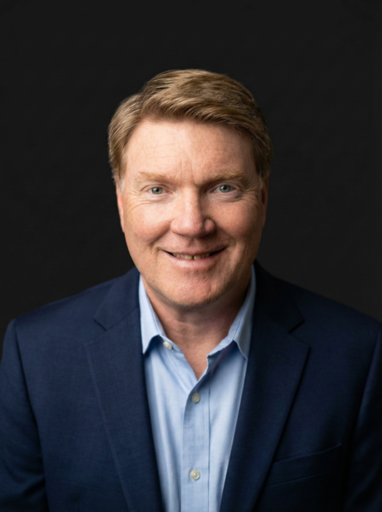 Services Ron Headshot Blue 765x1024